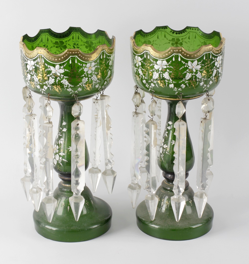 A pair of early 20th century green glass table lustres, each with a gilded collar, enamelled and