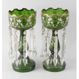A pair of early 20th century green glass table lustres, each with a gilded collar, enamelled and
