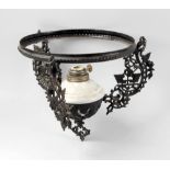 A box containing a late 19th century black painted cast iron framed hanging oil lamp, with white