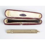 An S Mordan & Co 9ct gold pencil holder, the body of oblong form with ribbed decoration and