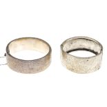 A selection of silver and white metal bangles. To include hinged bangles with engraved acanthus leaf