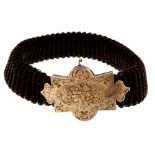 A mid Victorian memorial hair bracelet with 15ct gold clasp. The ribbed woven hair bracelet with