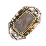 A 9ct gold mid Victorian enamel ouroboros memorial ring. The rectangular glazed woven hair panel