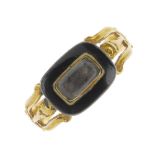 A mid to late Victorian 15ct gold enamel memorial ring. Designed as a rectangular panel with black