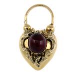 A late Victorian gold and garnet cabochon memorial clasp. Designed as a heart-shape clasp, with