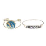 A selection of silver and white metal bangles. To include a selection of hinged bangles, many with