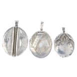 Three late Victorian silver lockets. All of oval outline, the first with overlaid ribbon design