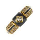 A late Victorian 18ct gold diamond and enamel memorial ring. The central diamond to a black enamel
