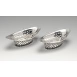 A pair of late Victorian silver bonbon dishes, each of navette shape with stippled and punched
