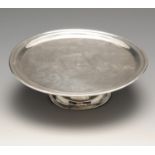 An early Georgian Irish silver small tazza, the plain circular form with dished rim and raised above