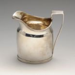 A George III silver cream jug, the plain oval body having a reeded rim and flat-top handle with
