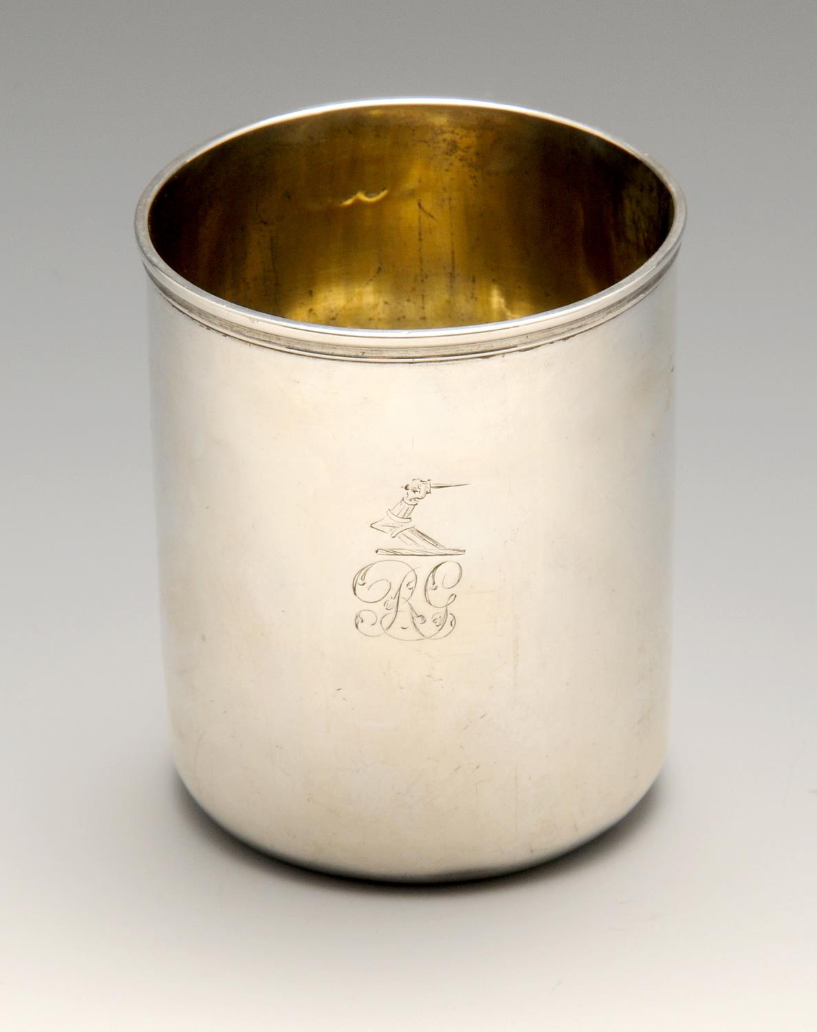 A George III silver beaker, the plain cylindrical form, crested and initialled, rising to the