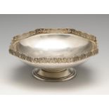 A 1930's silver dish, the circular body raised on a circular foot, and rising to an octagonal rim
