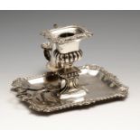 A George IV silver chamberstick, the rectangular base with canted corners and gadrooned rim