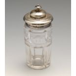 An early Victorian silver mounted condiment jar, the circular cut-glass body with a domed hinged