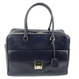 ANYA HINDMARCH - a Carker leather handbag. Designed with a smooth navy blue leather exterior, with