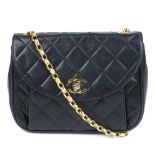 CHANEL - a vintage quilted leather handbag. Crafted from diamond quilted navy blue lambskin leather,