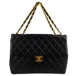 CHANEL - a Jumbo Classic Flap handbag. Featuring maker's iconic black quilted lambskin leather