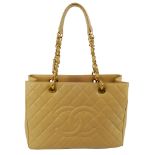 CHANEL - a cream Grand Shopping Tote. Crafted from cream caviar leather with maker's classic diamond