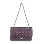 CHANEL - a purple 2.55 Reissue 226 handbag. Designed with a metallic purple quilted leather