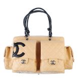 CHANEL - a beige Ligne Cambon reporter handbag. Featuring a beige quilted lambskin leather