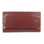 CARTIER - an envelope clutch. Crafted from maker's classic burgundy leather, with maker's front logo