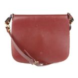 CARTIER - a Must De Cartier crossbody handbag. Crafted from maker's signature Bordeaux leather, with