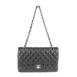 CHANEL - a Medium Classic Double Flap handbag. Designed with maker's iconic diamond quilted black