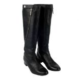 CHANEL - a pair of black leather Zip-Twist knee-high boots. Crafted from supple grained black