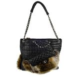 CHANEL - a Fantasy Fur Karl Cabas handbag. Crafted from quilted black calfskin leather with a