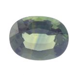 An oval-shape green sapphire, weighing 5.32cts. Sapphire is medium green, with blue colour zoning,