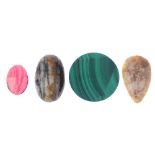 A selection of gemstones. To include vari-shape banded agate panels, a rutiliated quartz figa, two