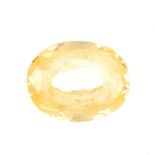 An oval-shape yellow sapphire, weighing 4.55cts. Sapphire is a medium yellow, fairly well