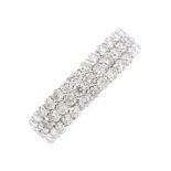 An 18ct gold diamond full eternity ring. Comprising three brilliant-cut diamond rows. Total