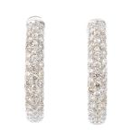 A pair of 18ct gold diamond earrings. Each designed as a pave-set diamond hoop. Estimated total