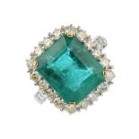 An 18ct gold emerald and diamond cluster ring. The rectangular-shape emerald, with brilliant-cut