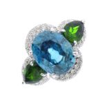 An 18ct gold zircon, diopside and diamond ring. The oval blue zircon and pear-shape diopside