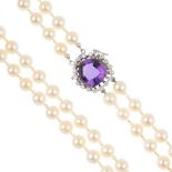 A cultured pearl two-row necklace. Comprising two cultured pearl strands, with seed pearl spacers