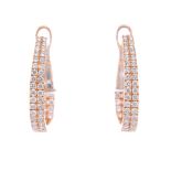 A pair of 18ct gold diamond earrings. Each designed as a front-facing pave-set diamond hinged