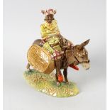 A Beswick figure, 'Susie Jamaica'. Modelled riding upon a donkey, model 1347, issued 1954 - 1975, 7,
