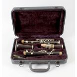 A cased clarinet. Of four sections, the lowest stamped 'JEROME THIBOUVILLE-LAMY 10 CHARTERHOUSE