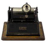 An Edison Gem phonograph. No. 375616, the japanned housing with gilt lettering, in domed oak-