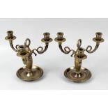 A pair of French silver-plated brass three-branch table candelabra. Each with central cast loop
