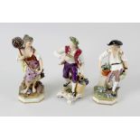 A group of five porcelain figures. Comprising: a pair attributable to Derby, he a gardener with