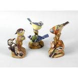 A group of eleven Royal Worcester porcelain birds. Comprising Pied Woodpeckers, Chaffinches,