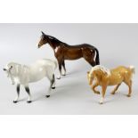 Five Beswick horses. Comprising a palomino, a grey, a racehorse, a Shetland pony, and a skewbald