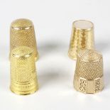 Four yellow metal thimbles. Comprising one marked 9ct, sponsor J.F., one marked 18CT, one stamped '