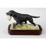 A Royal Worcester porcelain model of a Labrador. Matt black finish, modelled by Doris Lindner, 1975,