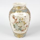 An early 20th century Japanese satsuma vase. Of ovoid form decorated with two panels, a vase of