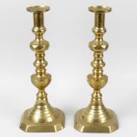 A large pair of Victorian brass candlesticks, each having a multi-knopped stem, the uppermost